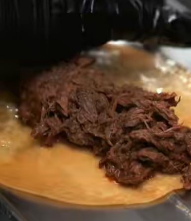 Shredded beef on a tortilla