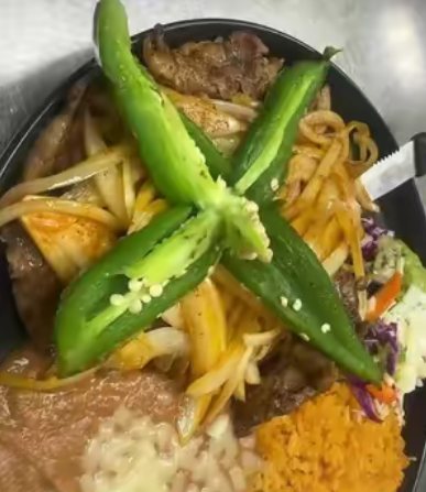 Skillet plate topped with grilled peppers